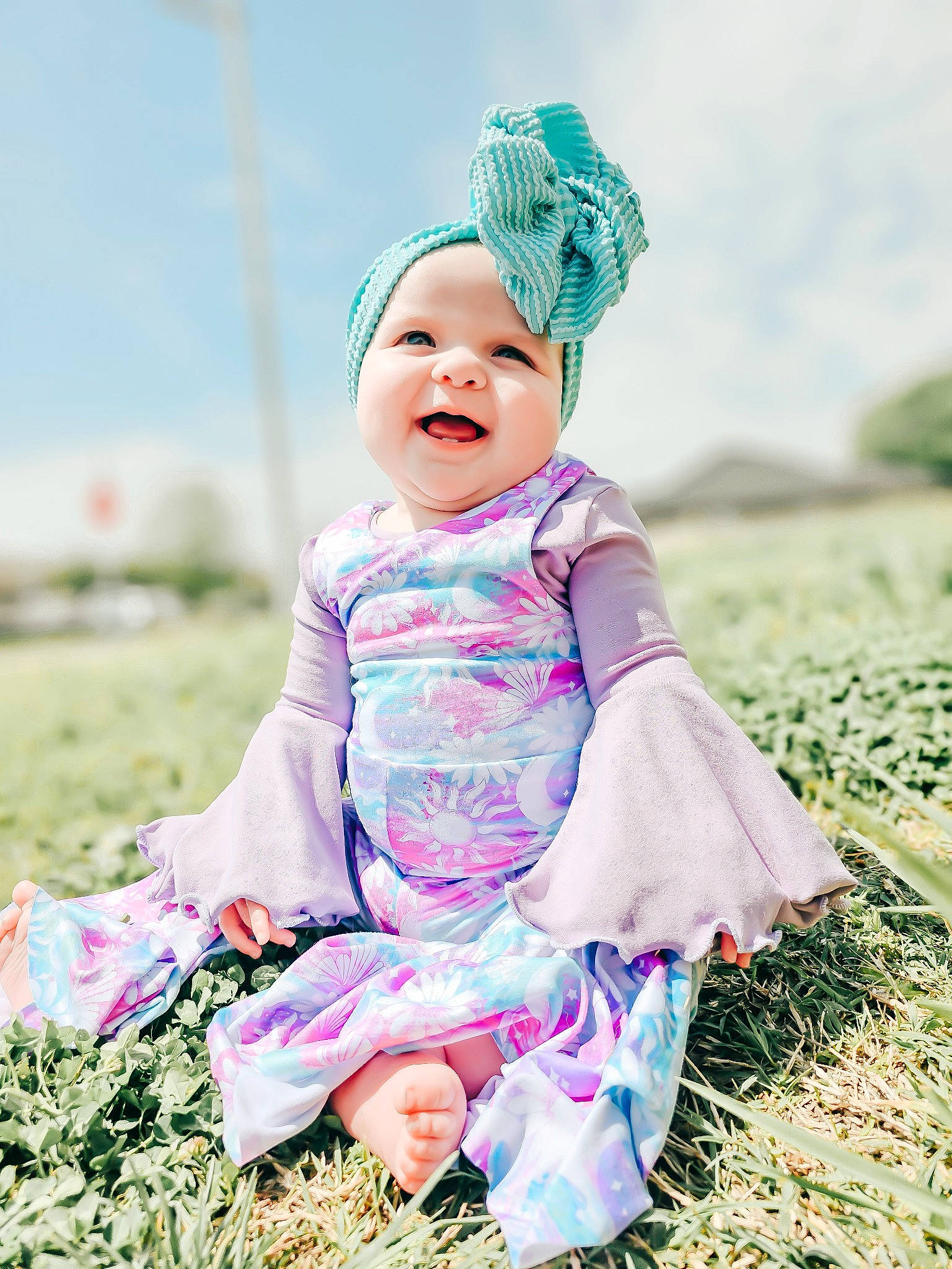 Serenity joined the competition — help win amazing prizes! baby, baby_toddler_clothing, child, dress, fun, grass, grassland, happy, headwear, magenta, pattern, people_in_nature, person, pink, plant, portrait_photography, purple, sitting, sky, sleeve
