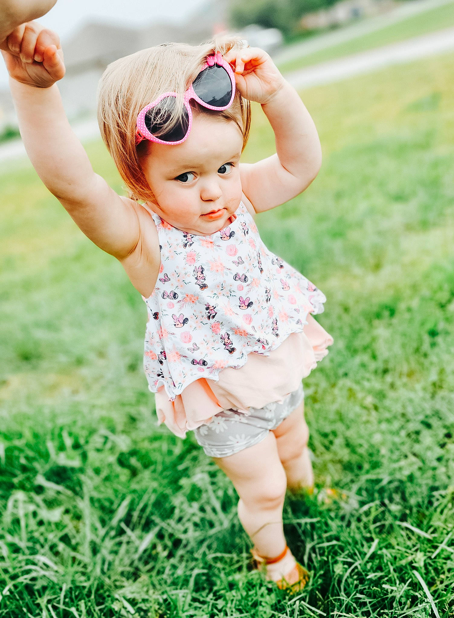 Harper Lakey is registered to the contest to win money with this photo: baby, baby_toddler_clothing, child, finger, flash_photography, fun, gesture, grass, grass_family, grassland, hand, happy, head, headwear, meadow, people_in_nature, person, pink, plant, skin