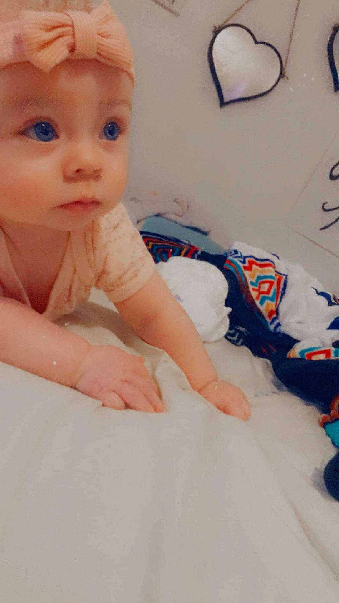 Adora is registered to the contest to win money with this photo: arm, baby, blue, cheek, chin, comfort, doll, eyebrow, eyelash, finger, headwear, human_body, iris, joint, lip, mouth, neck, nose, person, skin