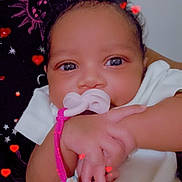 Tamiracle joined the competition — help win amazing prizes! baby, pacifier, hand, infant, cute, closeup, face, child, skin, expression, adorable, person, newborn, sleepwear, comfort, love, heart, background, soft, indoors