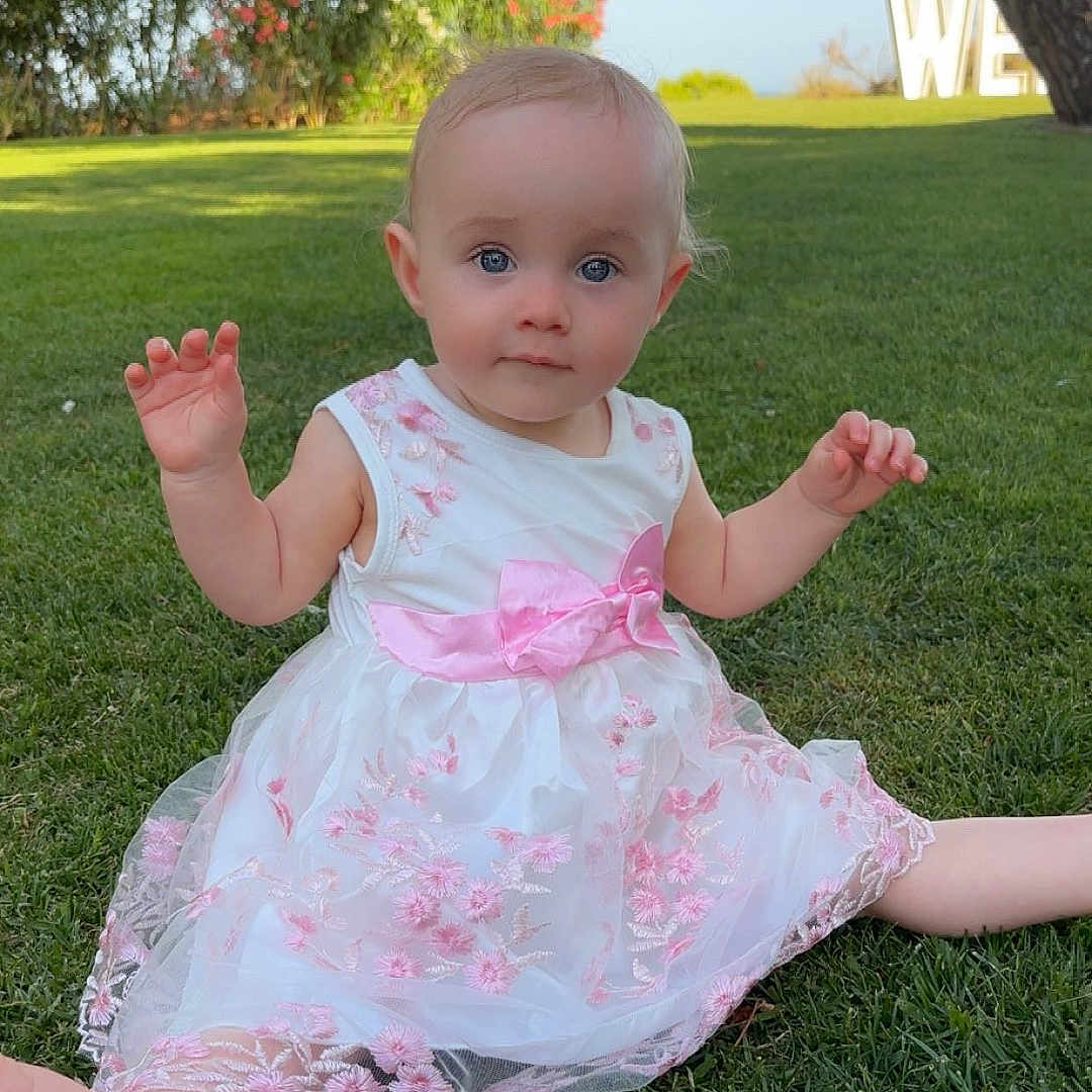 Remi-James joined the competition — help win amazing prizes! baby, blue_eyes, child, cute, dress, flowers, garden, grass, greenery, happy, infant, nature, outdoor, pink_bow, portrait, sitting, summer, sunlight, toddler, tree