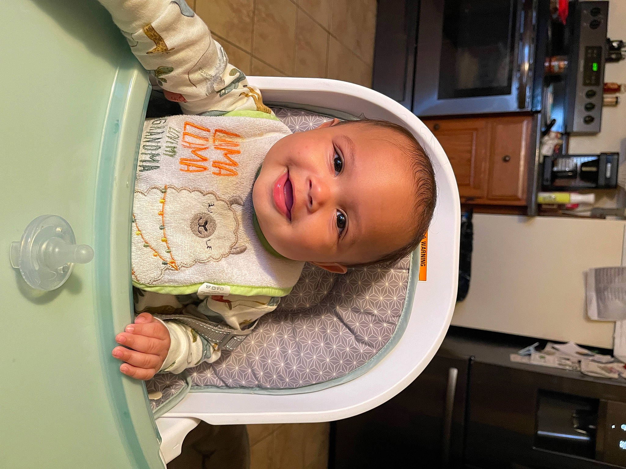 Kyson is registered to the contest to win money with this photo: baby, baby_products, baby_safety, baby_toddler_clothing, cabinetry, chair, child, comfort, fun, hat, home_appliance, joy, kitchen_appliance, person, refrigerator, room, smile, toddler