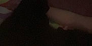 Bella joined the competition — help win amazing prizes! cat, black_cat, blanket, arm, dark, grainy, indoor, sleeping, pet, resting, shadow, colorful_blanket, feline, cozy, animal, night, low_light, soft, comfort, cuddle