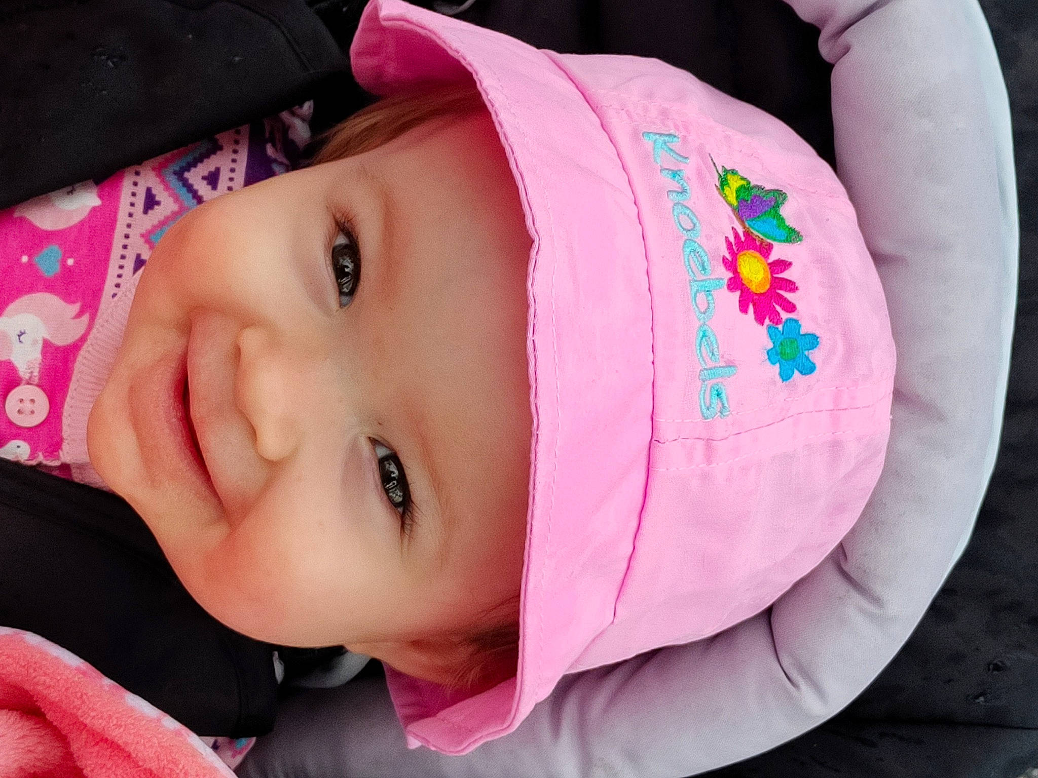 Jocelyn is registered to the contest to win money with this photo: baby, baby_toddler_clothing, cheek, child, eye, eyelash, face, facial_expression, happy, headgear, headwear, joy, lip, magenta, mouth, nose, person, pink, product, red
