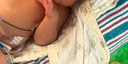 Royal is registered to the contest to win money with this photo: newborn, baby, infant, sleeping, blanket, nasal_tube, pacifier, medical, hospital, striped_blanket, patterned_blanket, cozy, cute, child, resting, indoors, person, soft, toddler, healthcare