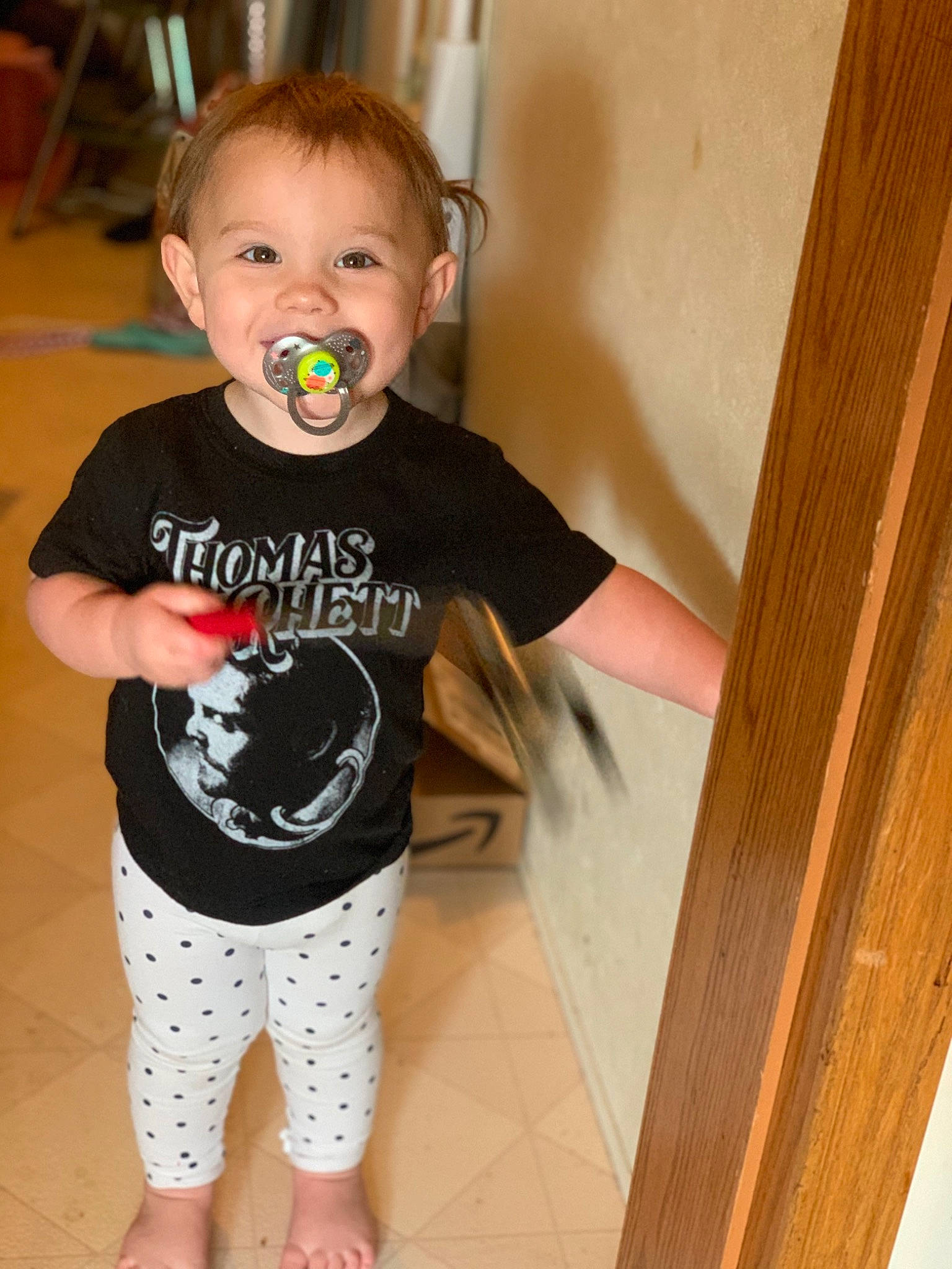 Kynslee is registered to the contest to win money with this photo: active_pants, baby, baby_toddler_clothing, barefoot, child, joint, joy, nightwear, pajamas, person, plywood, standing, toddler, tongue, tooth, wood_stain