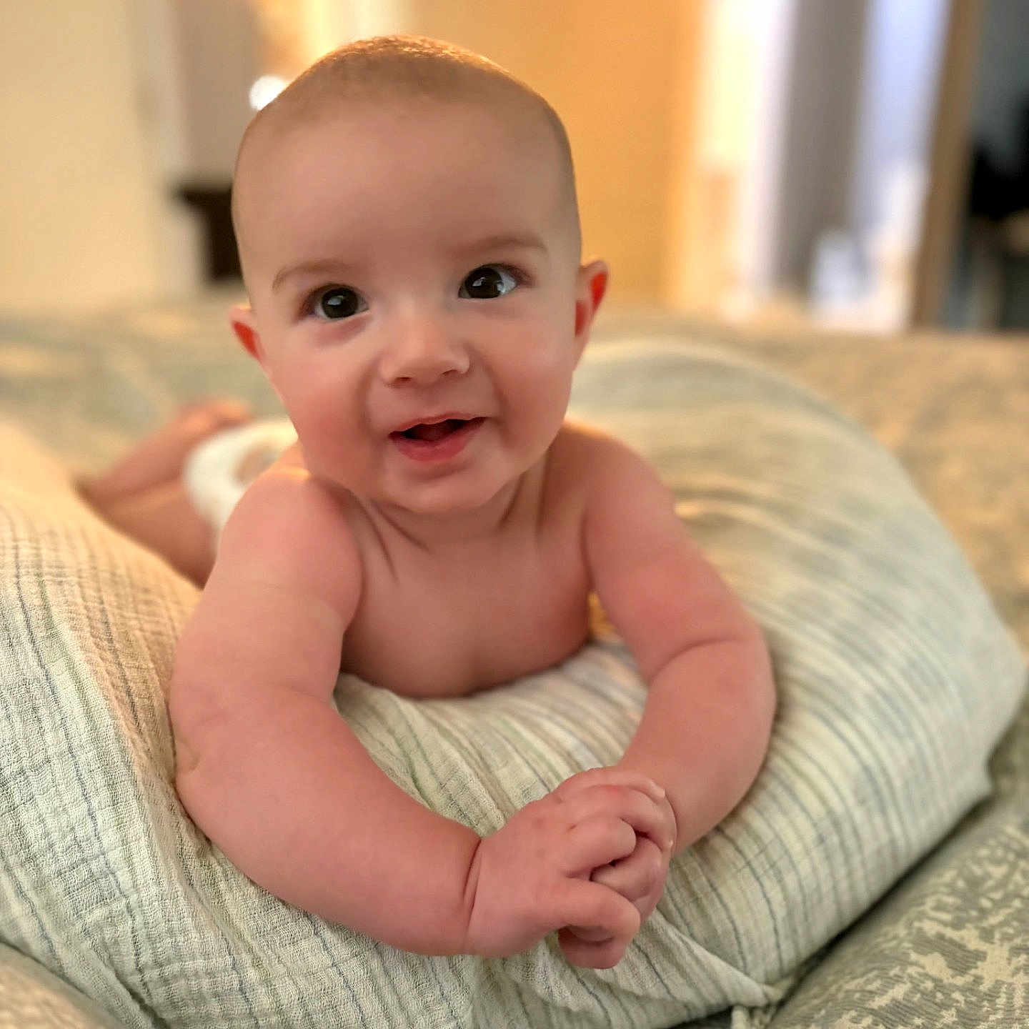 Jackson joined the competition — help win amazing prizes! arms, baby, bed, blanket, child, cozy, cute, expression, eyes, face, hands, happy, indoors, infant, newborn, pillow, portrait, skin, smiling, soft