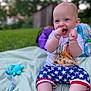 baby, child, smiling, happy, outdoor, grass, blanket, shorts, shirt, toy, playtime, summer, cute, clapping, blue_eyes, head, person, sitting, expression, fun