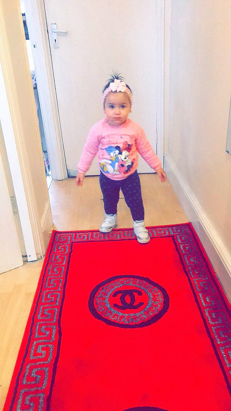 Romeisa joined the competition — help win amazing prizes! carpet, child, floor, flooring, mat, person, red, t_shirt, toddler