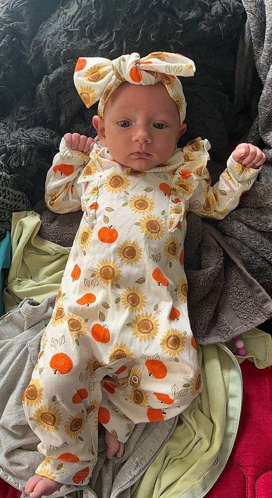 Angel Lynn is registered to the contest to win money with this photo: baby, baby_products, baby_toddler_clothing, cheek, child, day_dress, dress, face, flower, fun, happy, linens, outerwear, pattern, peach, person, pink, skin, sleeve, textile