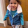 Amalia joined the competition — help win amazing prizes! child, girl, smiling, curly_hair, denim_jacket, long_sleeves, patterned_pants, green_slippers, indoor, wooden_floor, door, bag, standing, portrait, casual_clothing, cozy, happy, cute, young_child, person