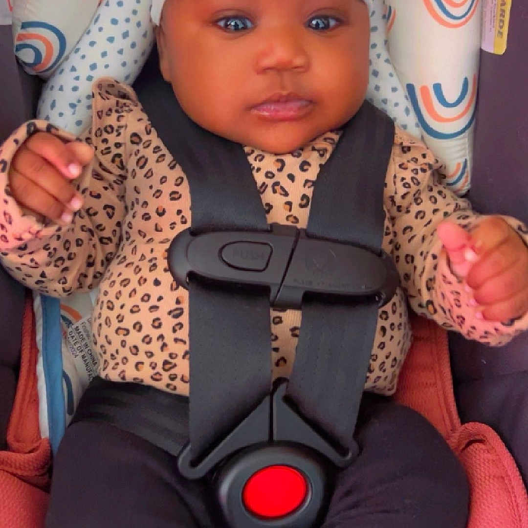 Isla-Monroe is registered to the contest to win money with this photo: accessories, baby, bodypart, bonnet, cap, car, car_interior, clothing, cushion, face, finger, hand, hat, head, homedecor, person, photography, portrait, transportation, vehicle