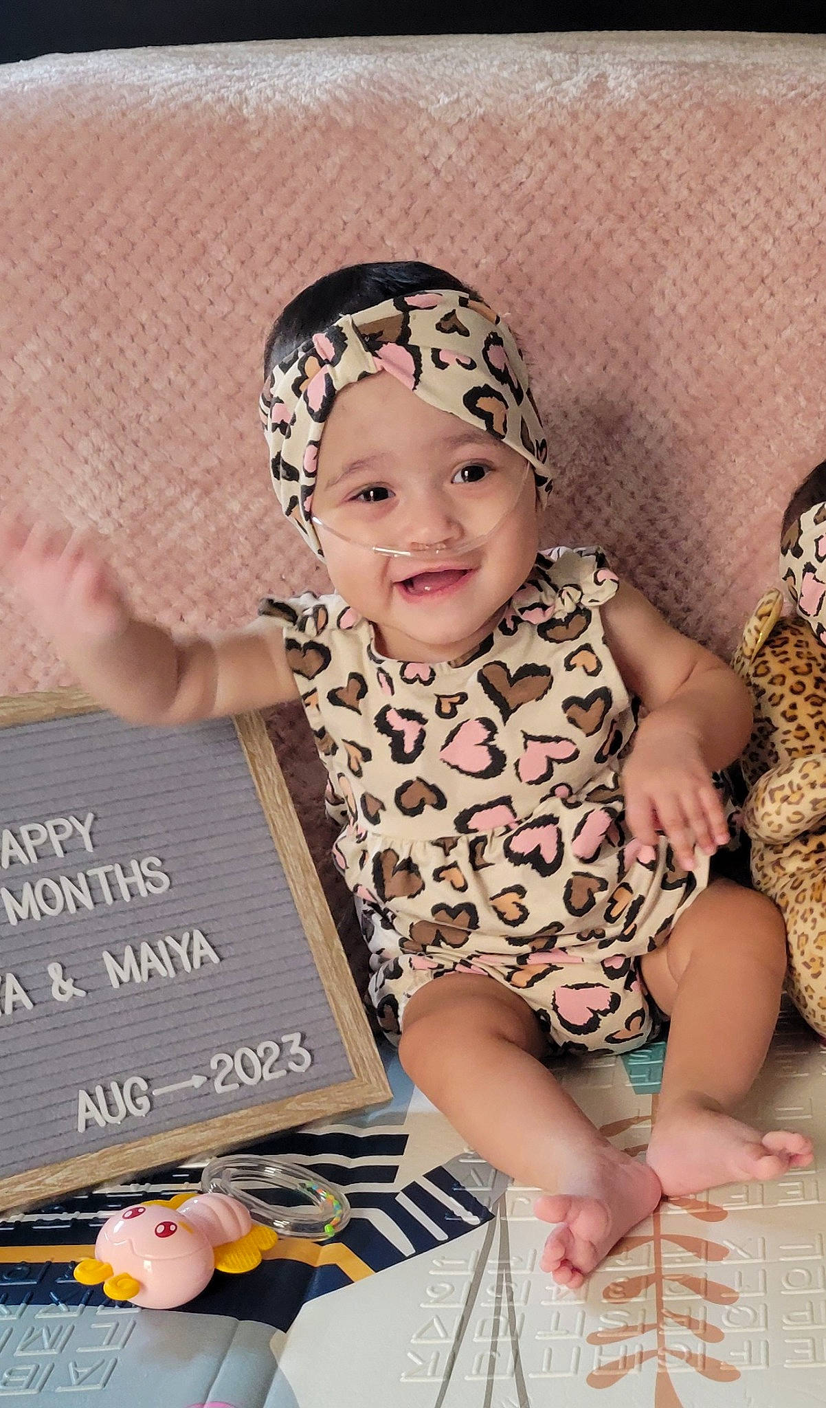 Maiya joined the competition — help win amazing prizes! baby, baby_products, baby_toddler_clothing, cap, child, event, fashion_accessory, font, fun, happy, headband, headpiece, headwear, joy, laugh, pattern, person, pink, room, sitting