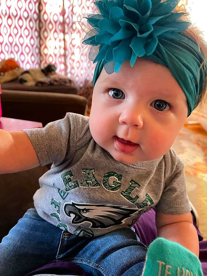 Annabella joined the competition — help win amazing prizes! baby, baby_toddler_clothing, blue, cap, cheek, child, chin, clothing, costume_hat, face, finger, fun, green, happy, hat, headgear, headwear, person, sitting, skin