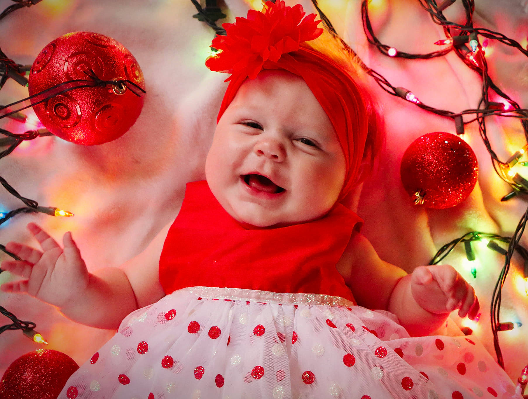 Annabella is registered to the contest to win money with this photo: baby, baby_toddler_clothing, beauty, child, event, facial_expression, flower, fun, happy, headwear, organ, people, person, petal, photograph, pink, plant, red, skin, smile