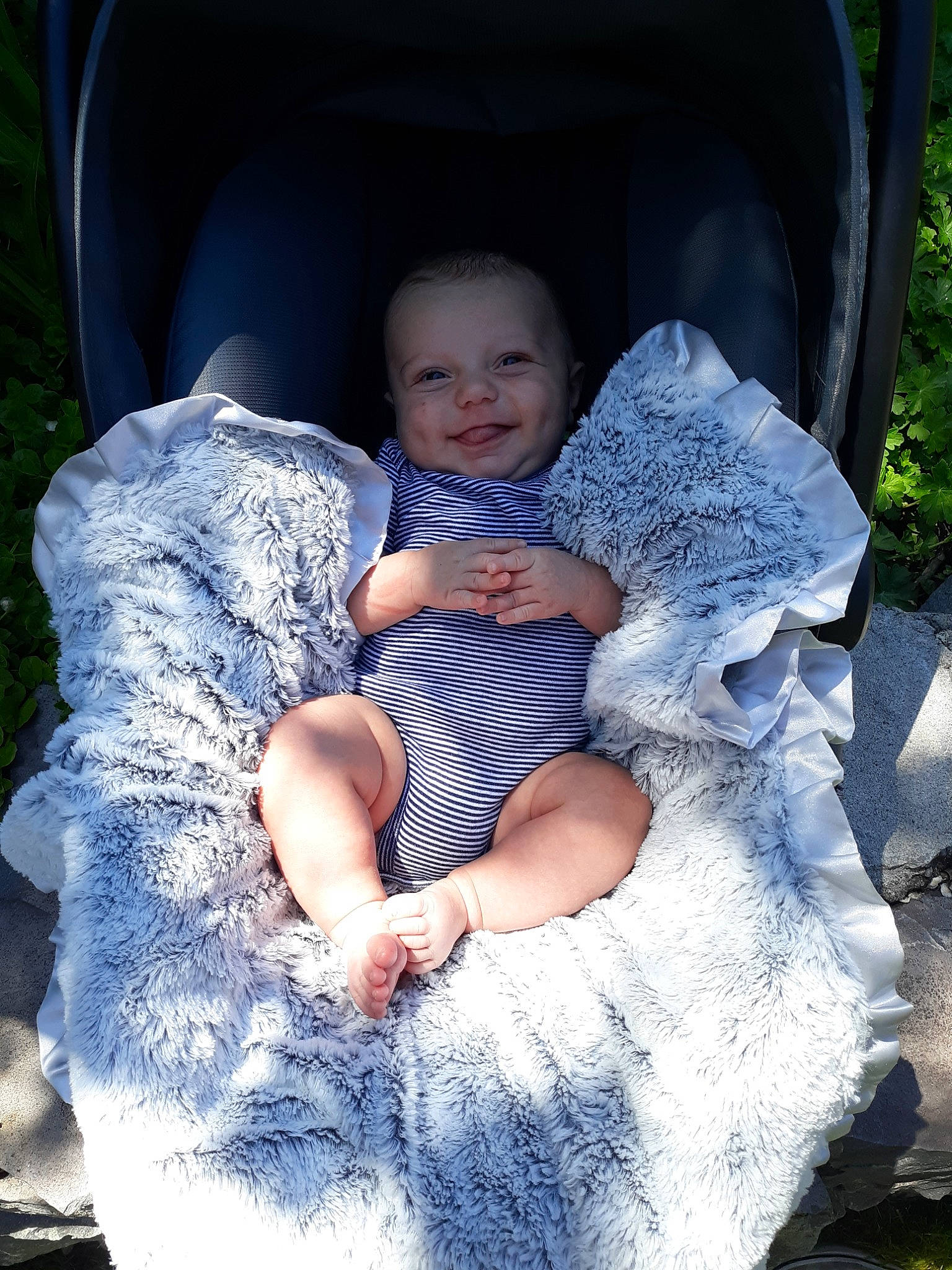 Aleister is registered to the contest to win money with this photo: baby, baby_products, blue, child, daughter, eye, fun, happy, joy, leisure, people, person, photograph, photography, plant, product, sitting, smile, toddler, tree