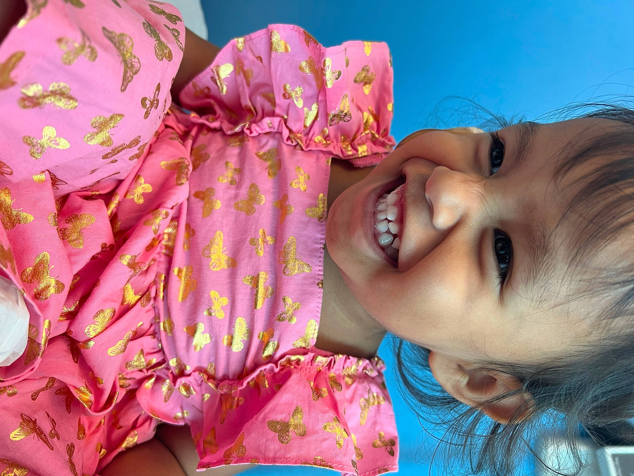 Honey is registered to the contest to win money with this photo: baby, baby_toddler_clothing, cheek, chin, eye, eyelash, face, happy, head, human_body, joy, lip, mouth, nose, person, pink, skin, sleeve, smile, textile