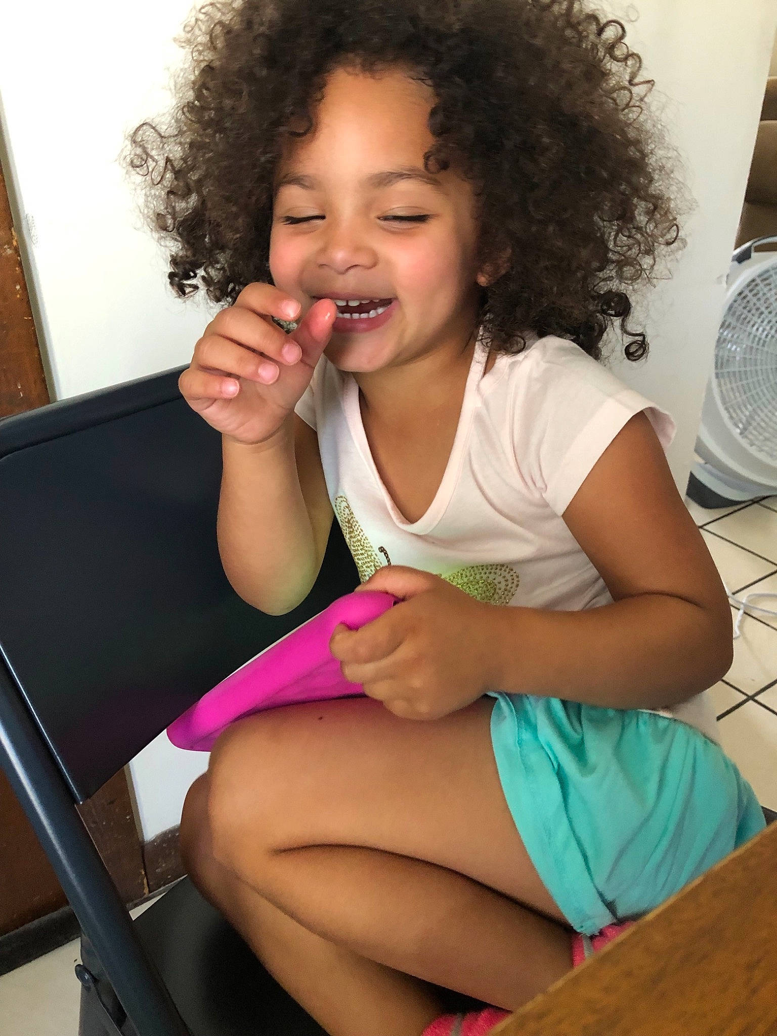 Lia joined the competition — help win amazing prizes! arm, black_hair, cheek, child, face, finger, fun, hair, hairstyle, human_leg, joy, leg, long_hair, neck, person, sitting, smile, thigh, toddler