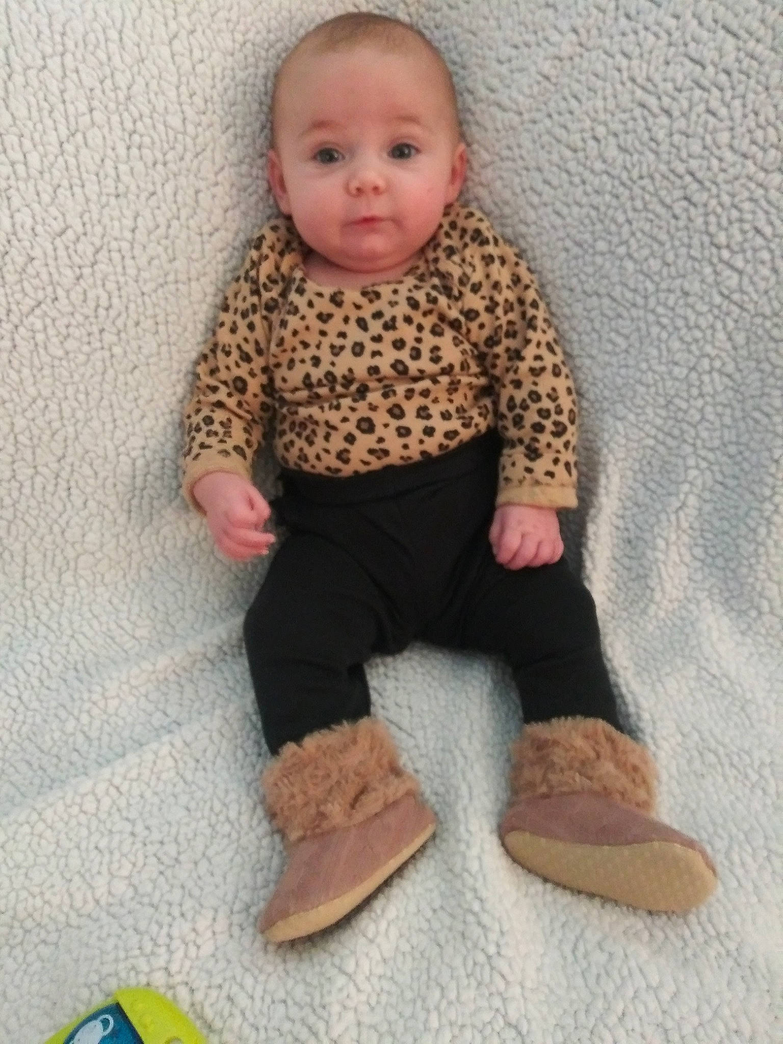 Olivia is registered to the contest to win money with this photo: baby, baby_toddler_clothing, brown, child, footwear, outerwear, person, shoe, skin, sleeve, toddler