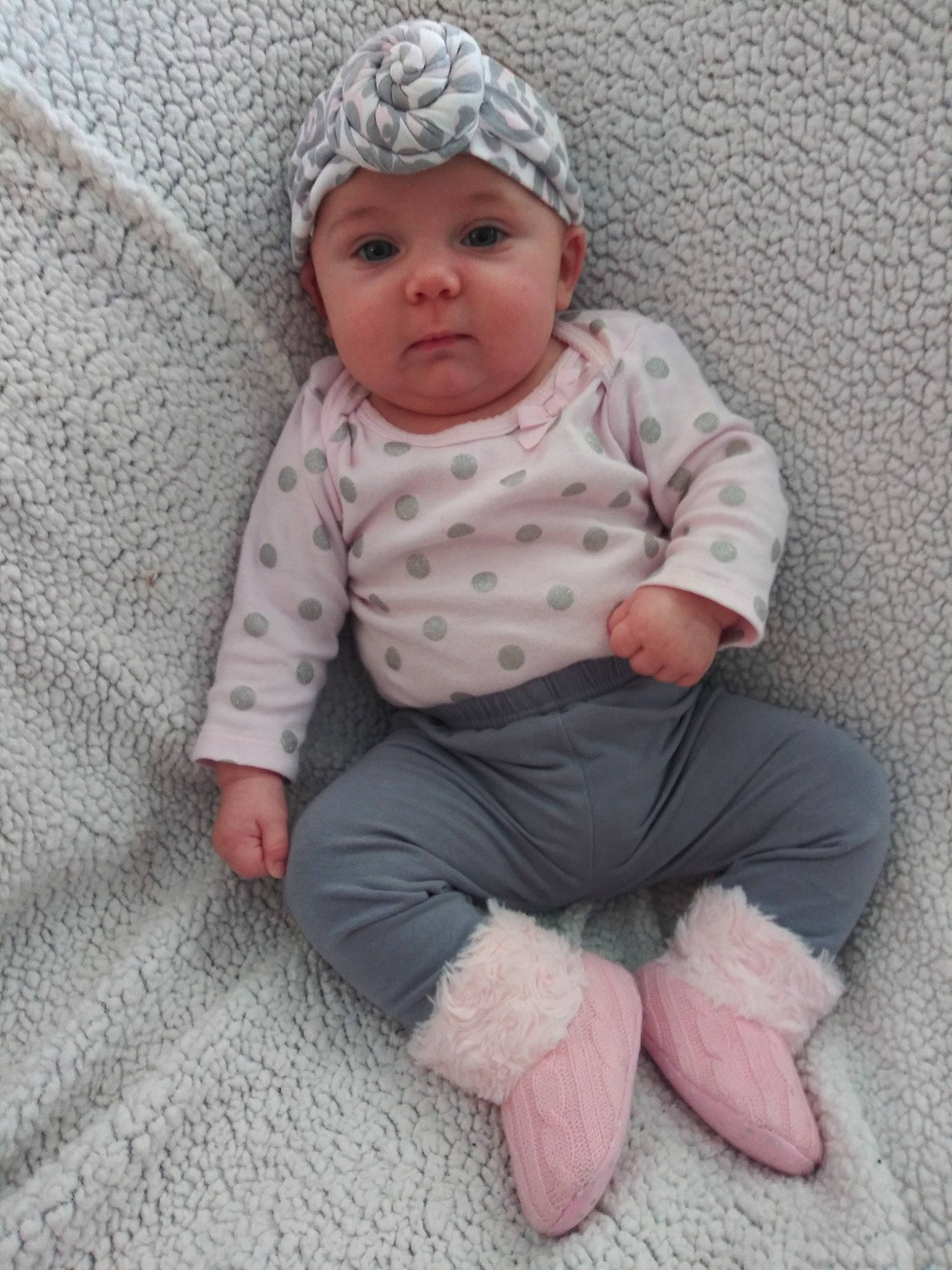 Olivia is registered to the contest to win money with this photo: baby, baby_products, baby_toddler_clothing, child, headgear, headwear, knitting, pattern, person, pink, sitting, skin, sleeve, toddler, wool