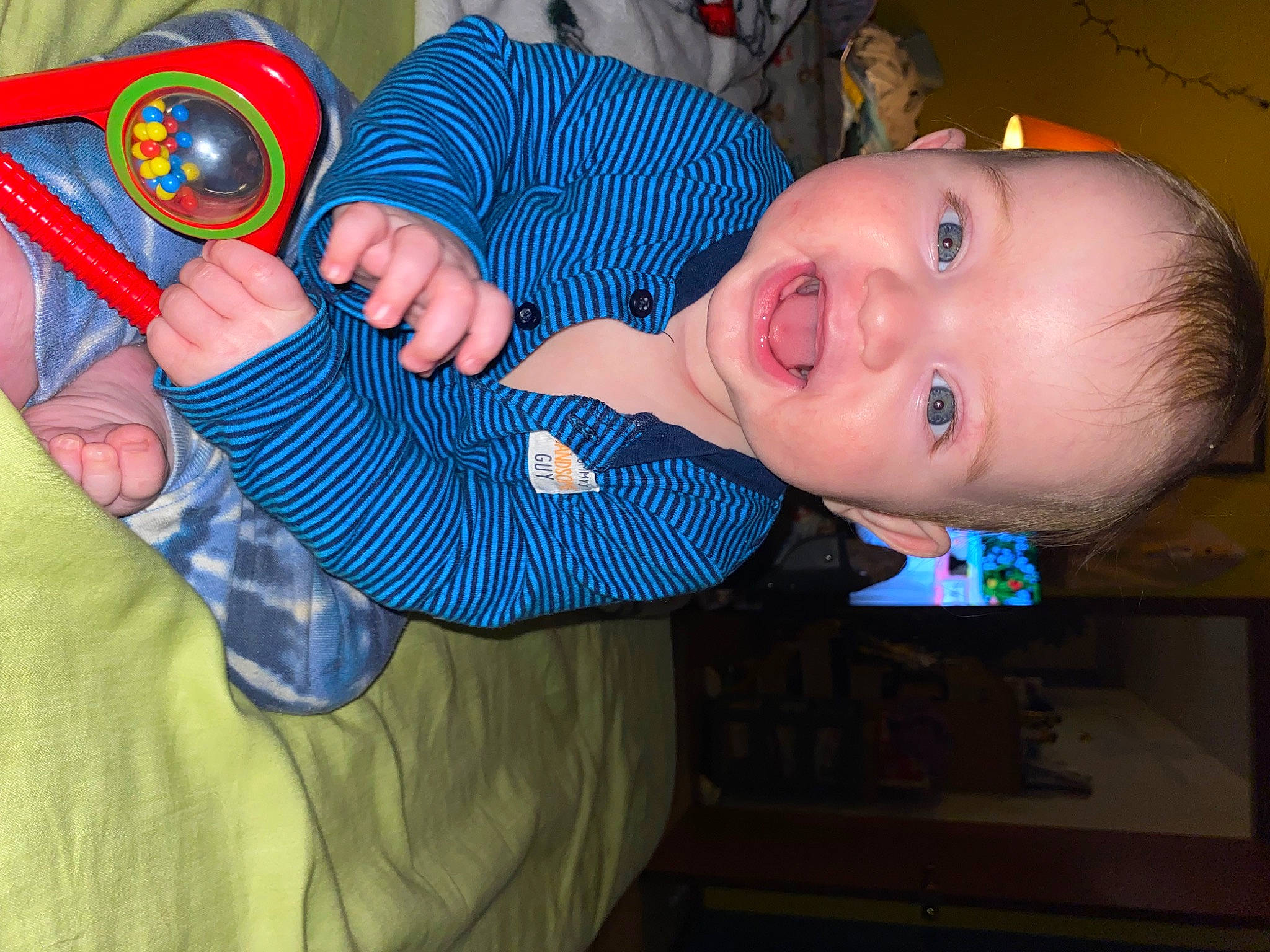 Christian joined the competition — help win amazing prizes! baby, baby_products, baby_safety, baby_toddler_clothing, cheek, child, electric_blue, finger, fun, happy, mouth, nail, pattern, person, room, sitting, sleeve, smile, thumb, toddler