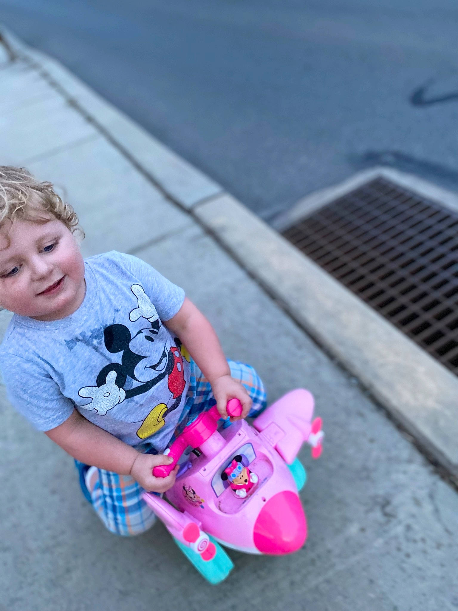 Aiyrian is registered to the contest to win money with this photo: asphalt, child, electric_blue, fun, grass, happy, leisure, person, play, recreation, riding_toy, rolling, shorts, sitting, skateboard, skateboarding_equipment, smile, toddler, toy, toy_vehicle