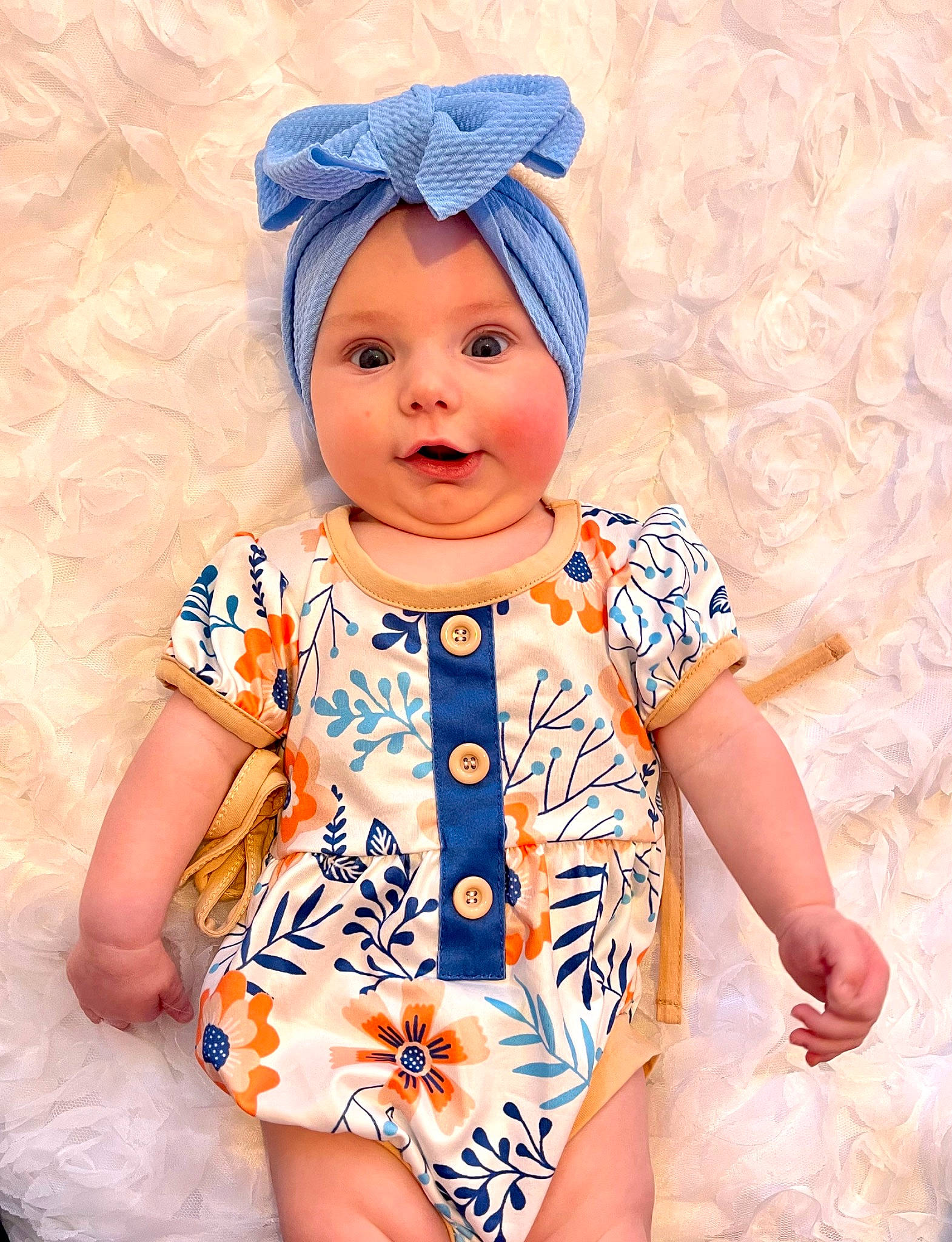 Natalie joined the competition — help win amazing prizes! azure, baby_toddler_clothing, blue, cheek, dress, eye, face, happy, head, headwear, lip, nose, one_piece_garment, orange, outerwear, person, pink, skin, sleeve, smile