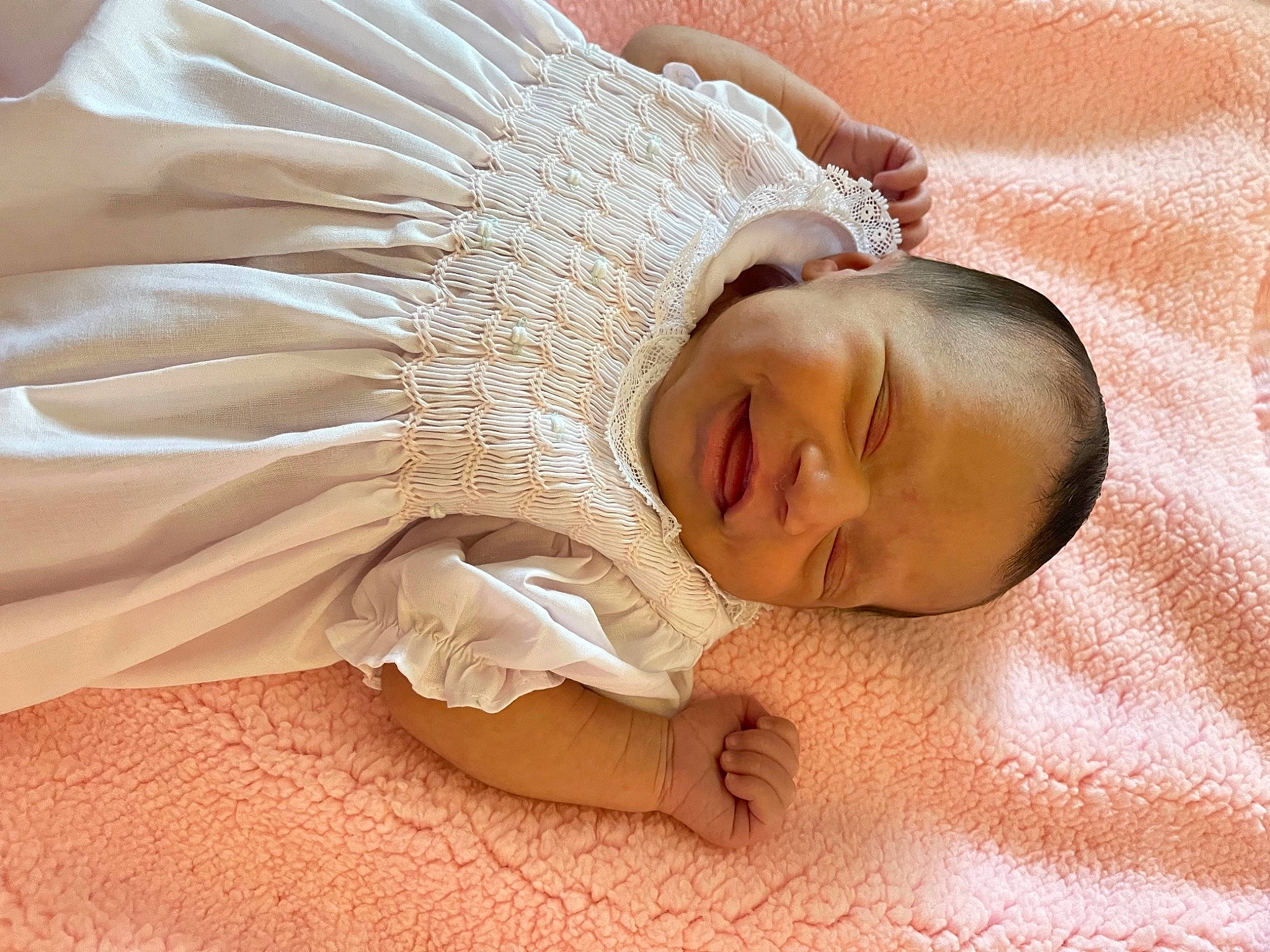 London is registered to the contest to win money with this photo: arm, baby, baby_sleeping, baby_toddler_clothing, bed, bedding, bedtime, bridal_accessory, child, comfort, embellishment, fashion_accessory, flooring, hair_accessory, head, headpiece, linens, nap, person, toddler