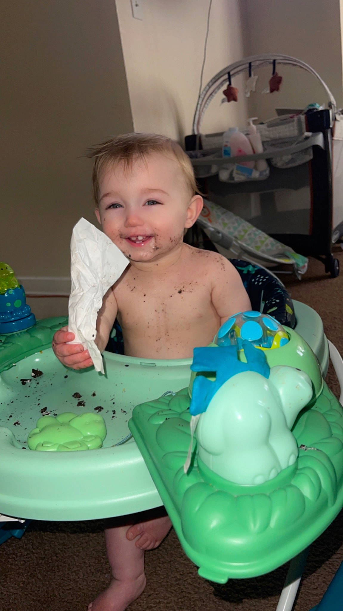 Cohen is registered to the contest to win money with this photo: baby, baby_products, baby_toddler_clothing, cheek, chest, child, diaper, dishware, drinkware, fun, green, happy, joy, person, plastic, plastic_bottle, product, serveware, sitting, skin