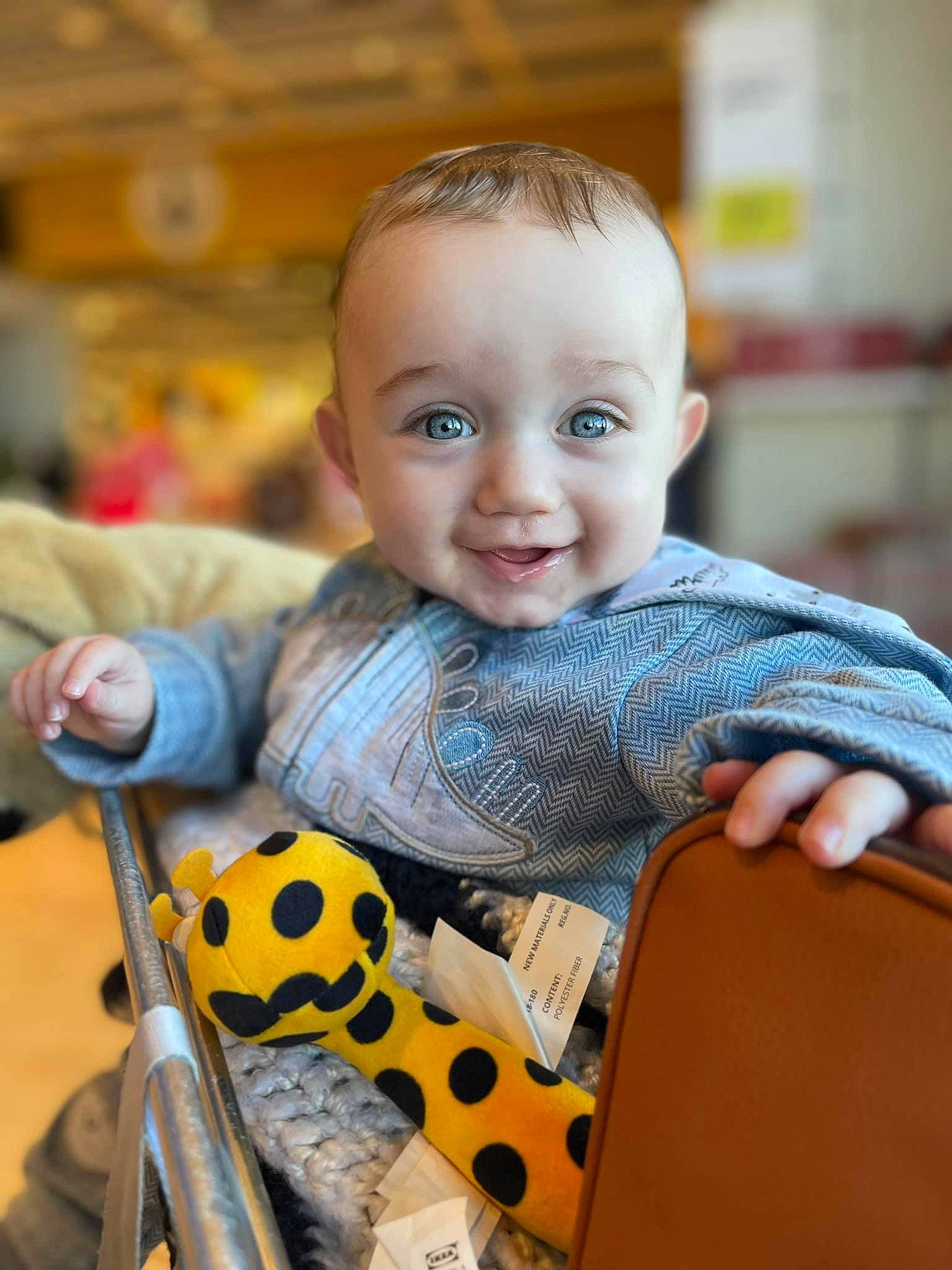 Cohen is registered to the contest to win money with this photo: baby, baby_products, baby_safety, baby_toddler_clothing, child, finger, fun, hair, happy, joy, orange, organ, pattern, person, sitting, skin, smile, stuffed_toy, textile, toddler