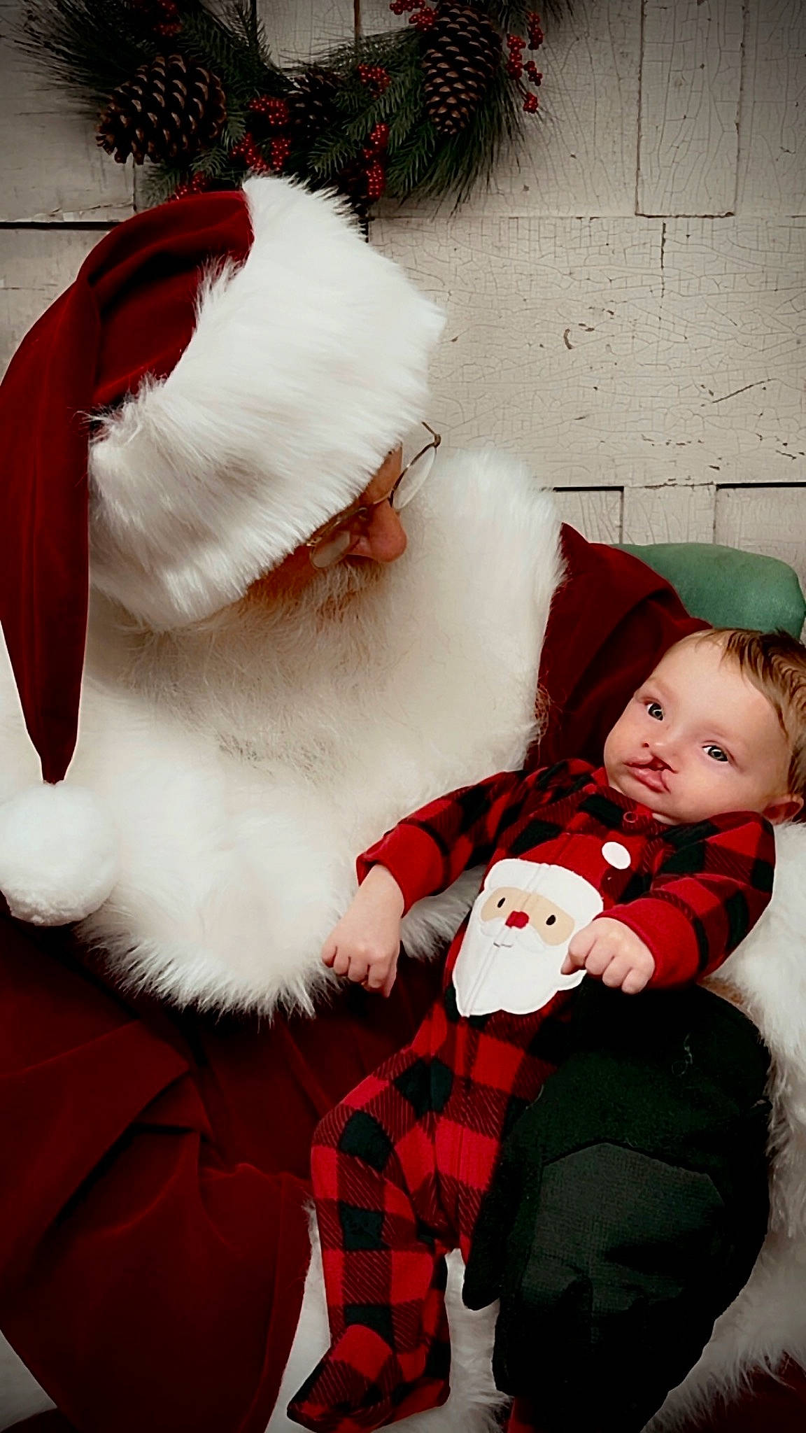 Braxton joined the competition — help win amazing prizes! baby, baby_toddler_clothing, christmas, christmas_eve, comfort, costume_hat, event, fur, fur_clothing, happy, hat, holiday, lap, natural_material, pattern, person, plaid, red, santa_claus, tartan