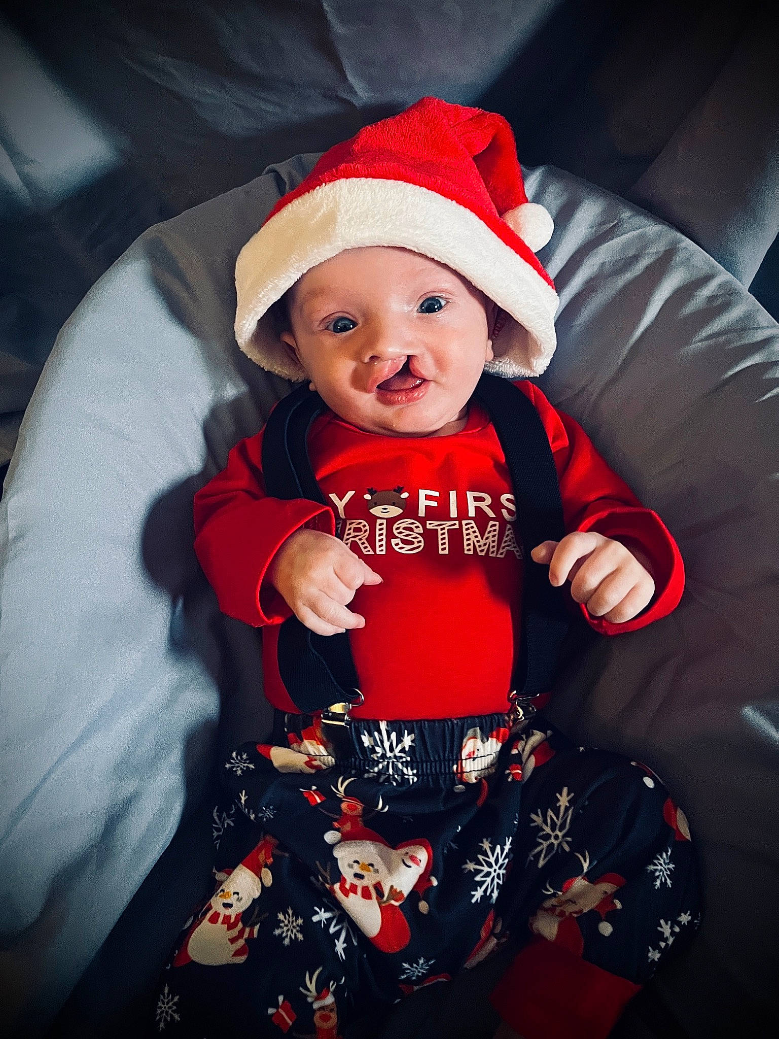 Braxton is registered to the contest to win money with this photo: baby, baby_toddler_clothing, cap, christmas, christmas_eve, comfort, costume_hat, event, fictional_character, happy, hat, headwear, holiday, human_body, lap, magenta, person, santa_claus, sleeve, smile