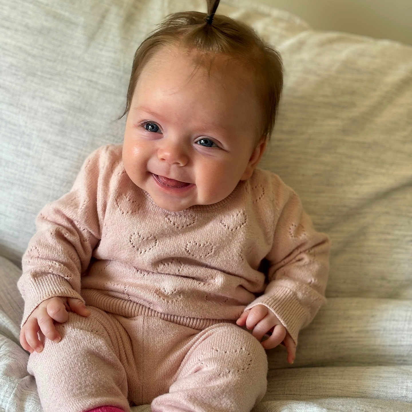 Olive joined the competition — help win amazing prizes! baby, babylaughing, bodypart, clothing, couch, face, finger, furniture, hand, happy, head, hosiery, knitwear, pants, person, photography, portrait, sitting, smile, sweater