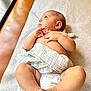 Kaya joined the competition — help win amazing prizes! baby, blanket, casual, changing_table, child, clothing, comfort, cute, diaper, foot, hand, indoor, infant, lying_down, newborn, person, resting, skin, soft, toes