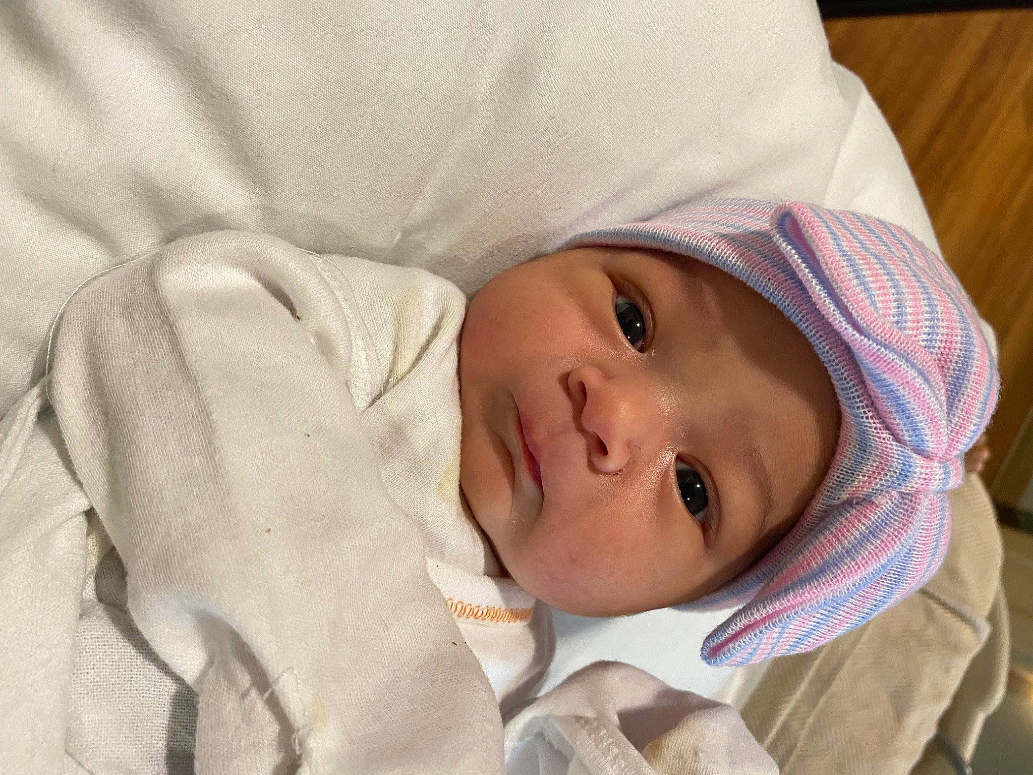 Freyja is registered to the contest to win money with this photo: baby, baby_toddler_clothing, cheek, child, collar, comfort, eyebrow, eyelash, fur, happy, hat, headwear, iris, linens, lip, nose, person, portrait_photography, sleeve, smile