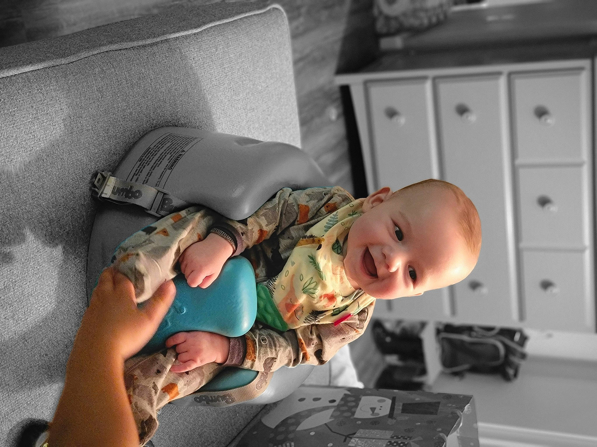 Linkin is registered to the contest to win money with this photo: baby, baby_products, baby_toddler_clothing, cabinetry, chest_of_drawers, child, comfort, drawer, elbow, flooring, fun, joy, person, room, sitting, smile, toddler, wood