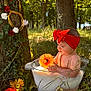 Anna participe au concours pour gagner de l'argent avec cette photo : baby, red_bow, headband, milk_bath, outdoor, nature, tree, flower, grass, sunlight, greenery, child, cute, summer, playful, portrait, peaceful, sunny, necklace, basin