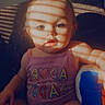 baby, child, infant, sitting, portrait, face, eyes, expression, pink_clothing, romper, toy, blue_toy, couch, indoor, window_light, sunlight, shadows, striped_shadows, close_up, photography