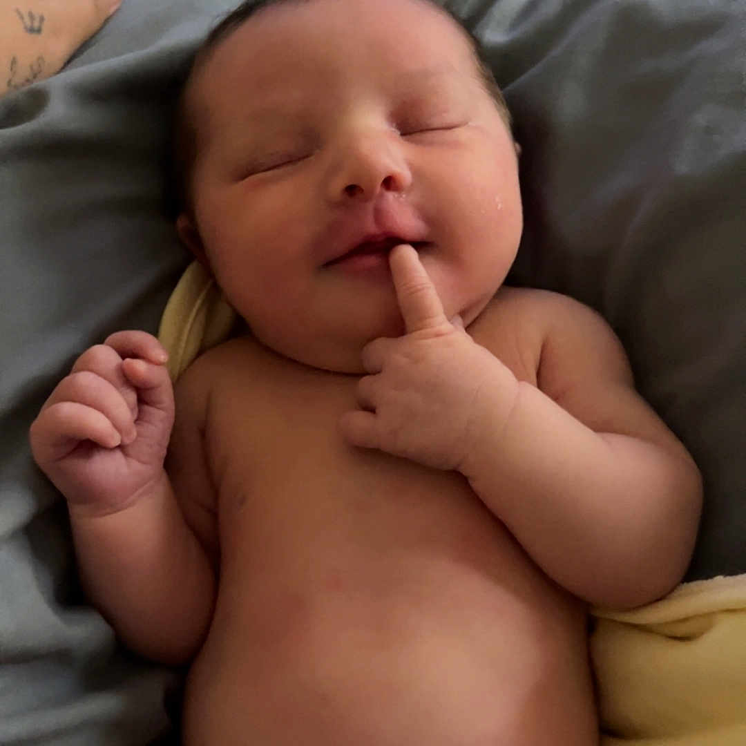 Jacie is registered to the contest to win money with this photo: baby, blanket, child, closeup, cute, finger, hand, human, indoors, infant, lying_down, newborn, peaceful, portrait, relaxing, resting, skin, sleeping, soft, tattoo