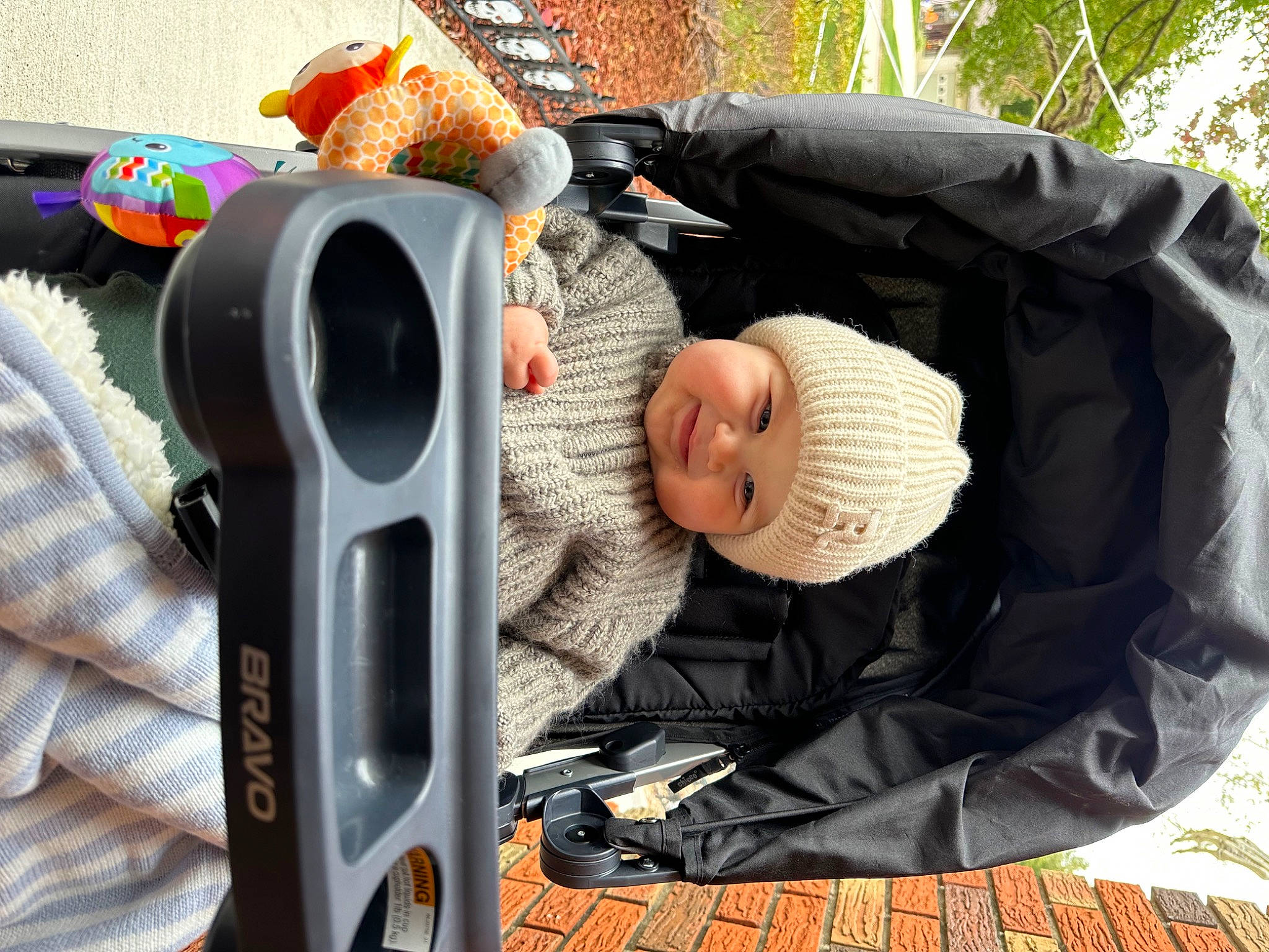 Rowan is registered to the contest to win money with this photo: audio_equipment, automotive_design, automotive_exterior, automotive_lighting, baby, baby_carriage, baby_products, baby_toddler_clothing, bumper, child, comfort, headwear, joy, luxury_vehicle, mammal, motor_vehicle, person, sitting, toddler, tree