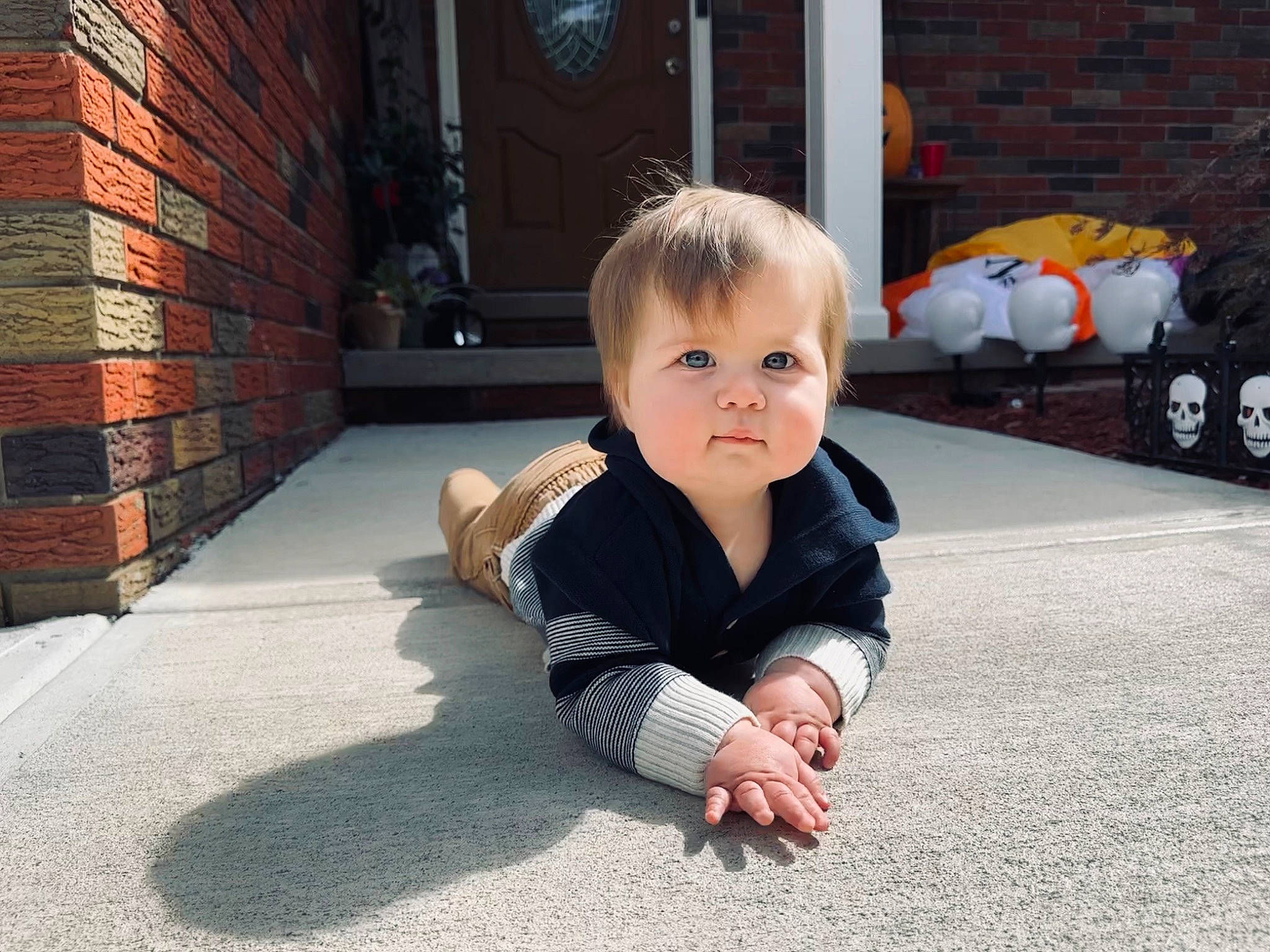 Rowan joined the competition — help win amazing prizes! asphalt, baby, baby_toddler_clothing, brick, brickwork, child, crawling, floor, flooring, fun, grass, leisure, person, road_surface, sidewalk, sitting, smile, street, toddler, vacation