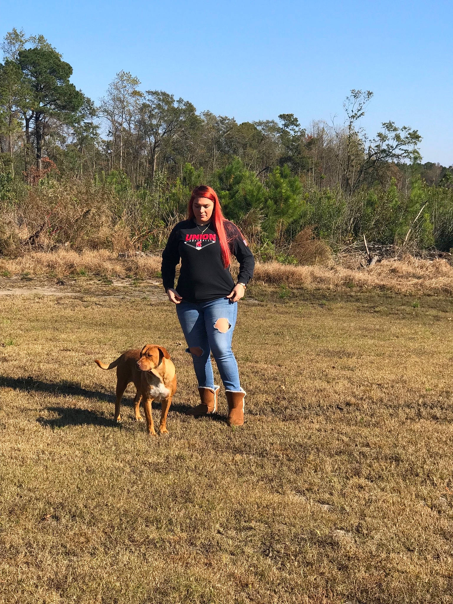 Macie is registered to the contest to win money with this photo: dog, dog_hiking, dog_like_mammal, dog_walking, field, fun, grass, grass_family, grassland, landscape, pasture, path, person, plant, prairie, rural_area, sand, soil, trail, tree