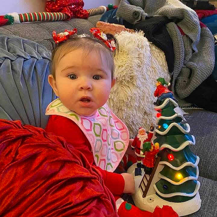 Leilani joined the competition — help win amazing prizes! adult, baby, blanket, christmas, christmasdecorations, christmasstocking, clothing, couch, cushion, face, female, festival, furniture, head, homedecor, hosiery, person, photography, portrait, woman