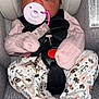 Khyla joined the competition — help win amazing prizes! baby, infant, car_seat, pacifier, sleeping, pink, floral_pajamas, child, straps, seatbelt, cute, cozy, clothing, face, head, person, newborn, resting, indoors, soft_lighting