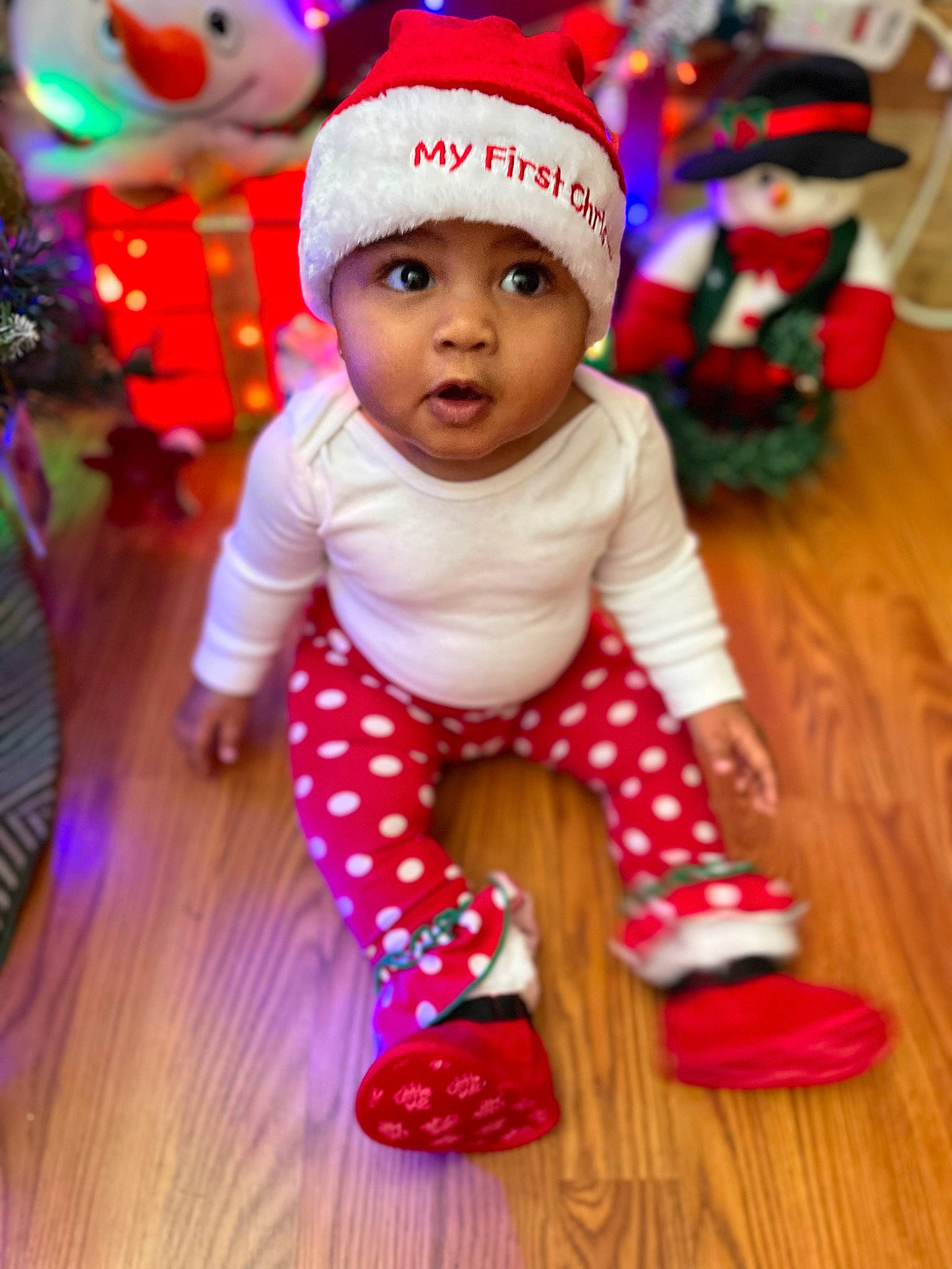 Arya is registered to the contest to win money with this photo: baby, baby_toddler_clothing, cap, child, costume_hat, event, flooring, fun, happy, headwear, holiday, magenta, mammal, outerwear, person, pink, purple, red, sleeve, textile