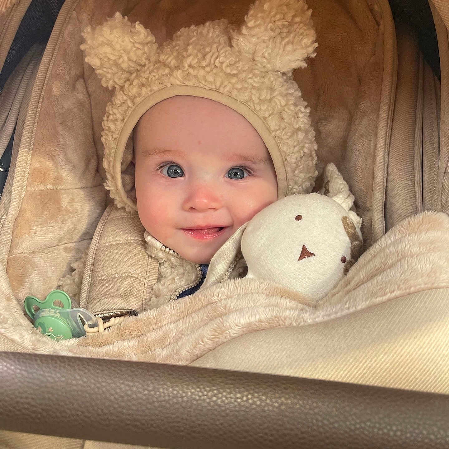 Ozzy joined the competition — help win amazing prizes! baby, bed, blanket, bonnet, cap, clothing, coat, crib, face, furniture, happy, hat, head, hood, infantbed, newborn, person, photography, portrait, smile