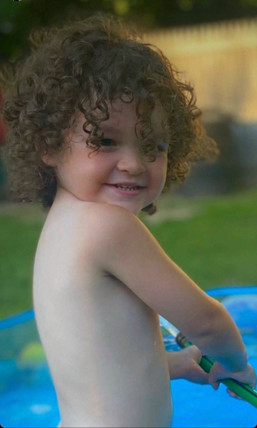 River joined the competition — help win amazing prizes! arm, chest, child, close_up, elbow, electric_blue, facial_expression, fun, gesture, grass, happy, human_body, joy, leisure, people, people_in_nature, person, recreation, skin, smile