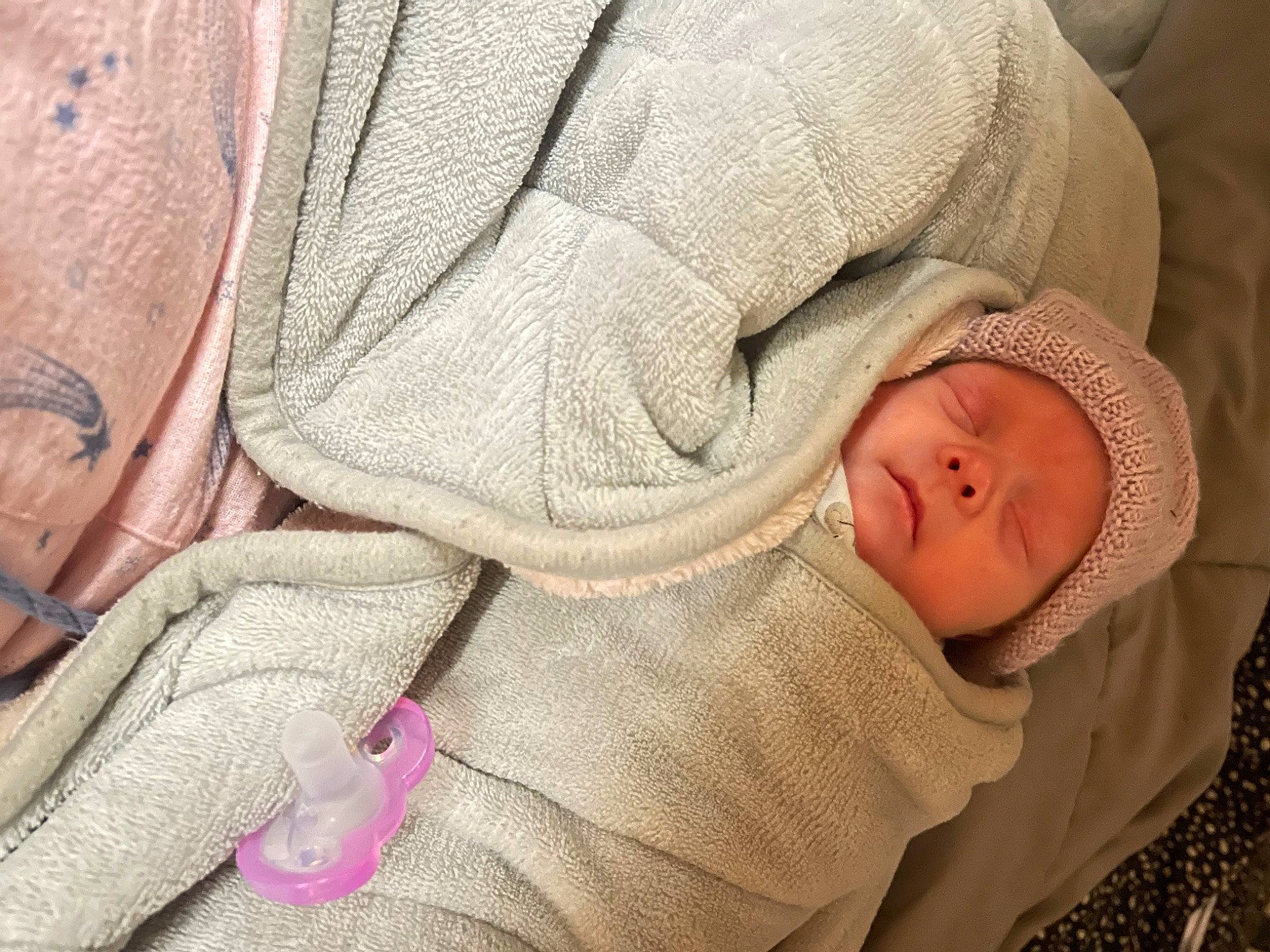 Bambi is registered to the contest to win money with this photo: baby, baby_products, baby_sleeping, baby_toddler_clothing, cheek, child, comfort, eye, hat, headgear, knit_cap, linens, mammal, outerwear, person, skin, sleeve, textile, toddler, wool