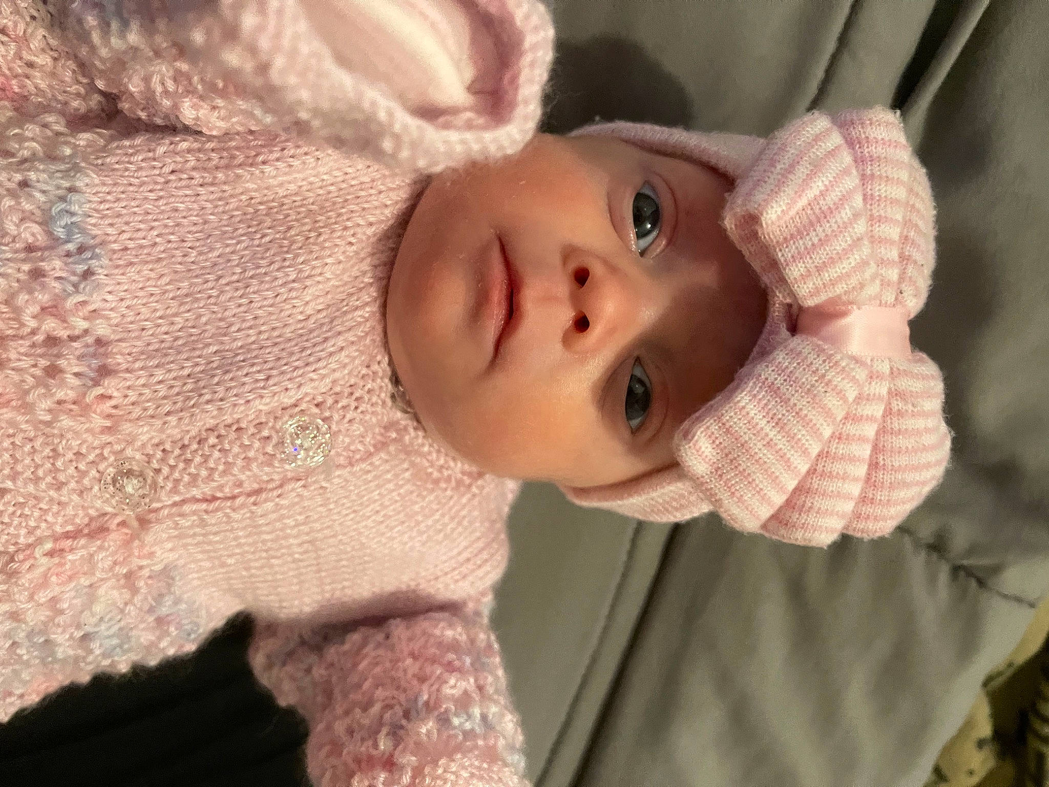 Bambi is registered to the contest to win money with this photo: baby, baby_toddler_clothing, cheek, child, creative_arts, eyelash, fashion_accessory, happy, headwear, iris, lip, nose, outerwear, person, pink, skin, sleeve, textile, toddler, wood