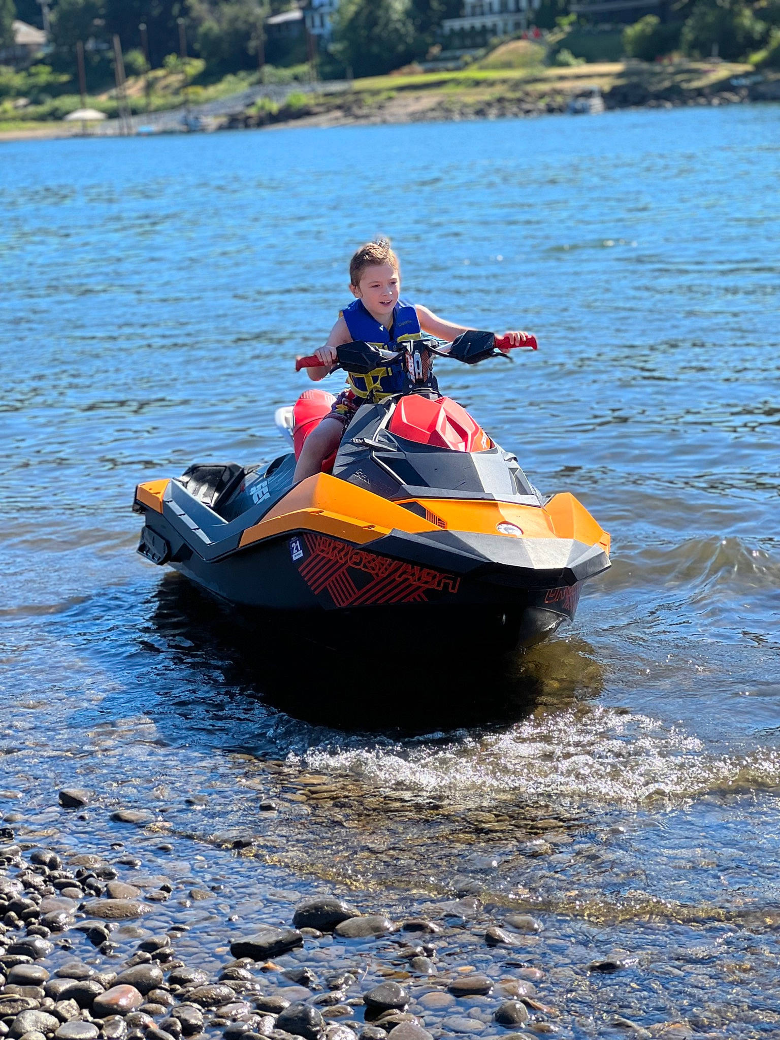 Tripp is registered to the contest to win money with this photo: boat, boating, boats_and_boating_equipment_and_supplies, jet_ski, lake, leisure, lifejacket, motorsport, person, personal_protective_equipment, personal_water_craft, powerboating, recreation, sports, surface_water_sports, tree, vehicle, water, water_sport, water_transportation